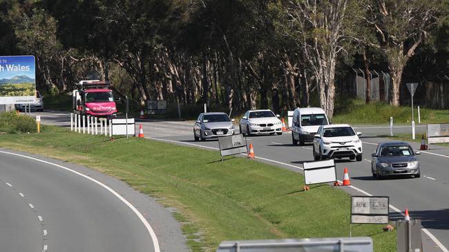 Police at the Queensland border check people before they enter the state. Picture: Nigel Hallett.