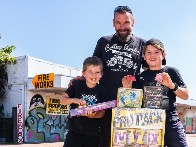 Hayden Hornsby, Adam Hornsby and Braxton Hornsby are stocking up with fireworks ahead of an explosive night of fun on Territory Day. Picture: Pema Tamang Pakhrin