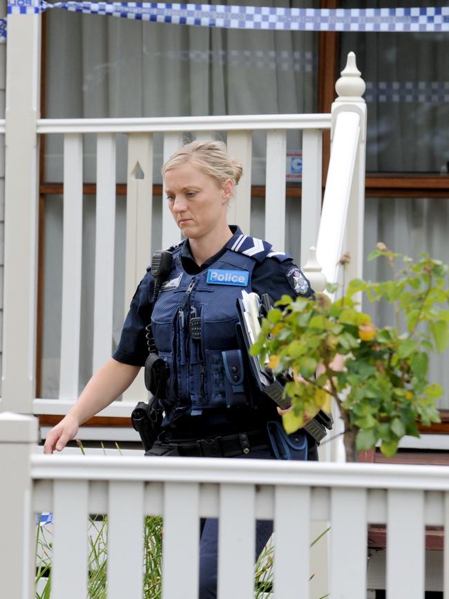 Police at the property. Picture: Andrew Henshaw