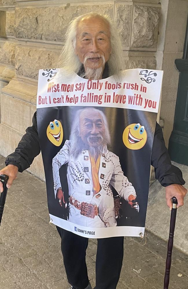 Danny Lim on January 5 on two walking sticks at Central Station for the Elvis Express, with an Elvis-themed outfit. Picture: Alexi Demetriadi