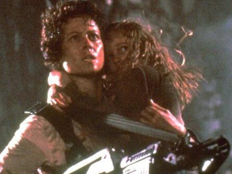 Actress Sigourney Weaver (L) and child actress Carrie Henn in the 1986 film "Aliens" movies scene Picture: Supplied