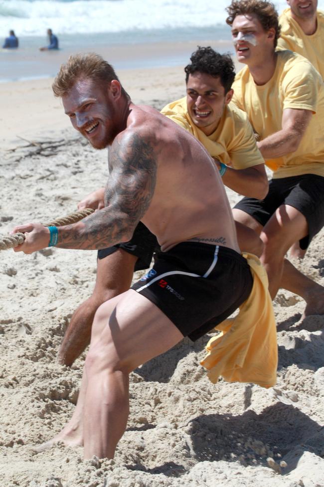 Mitch Johnson competing in a tug-of-war battle during the Southport Sharks VFL team’s preseason training camp at Tallebudgera Beach. Picture: Mike Batterham