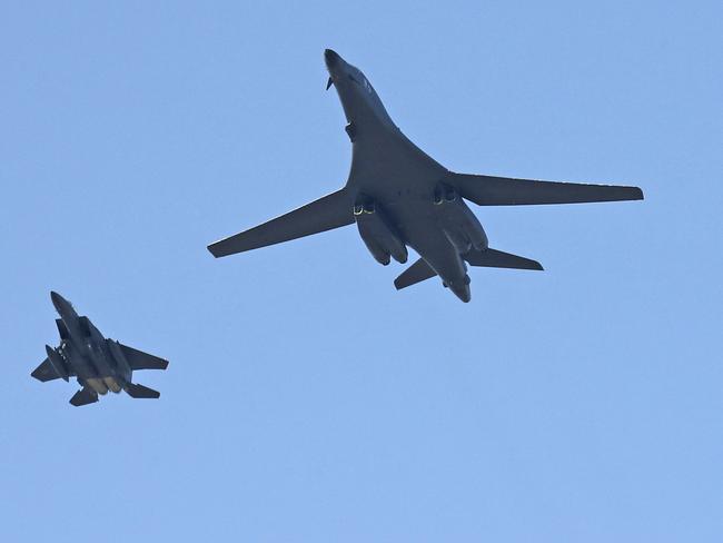 The US flew a B-1B bomber, right, and two South Korean fighter jets F-15K B-1B off the North Korean coast last month. Picture: Kim Do-hun/Yonhap/AP