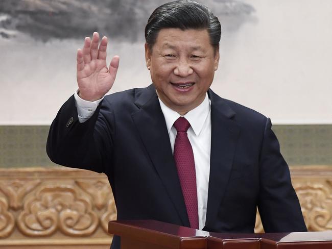 Chinese President Xi Jinping waving at the Great Hall of the People in Beijing. China's Communist Party is calling for the removal of presidential term limits. Picture:  AFP