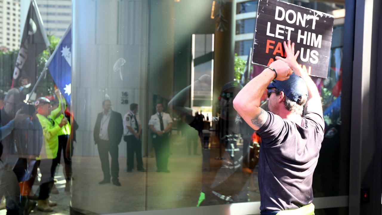 A protester at 1 William Street in Brisbane’s CBD. Picture: David Clark