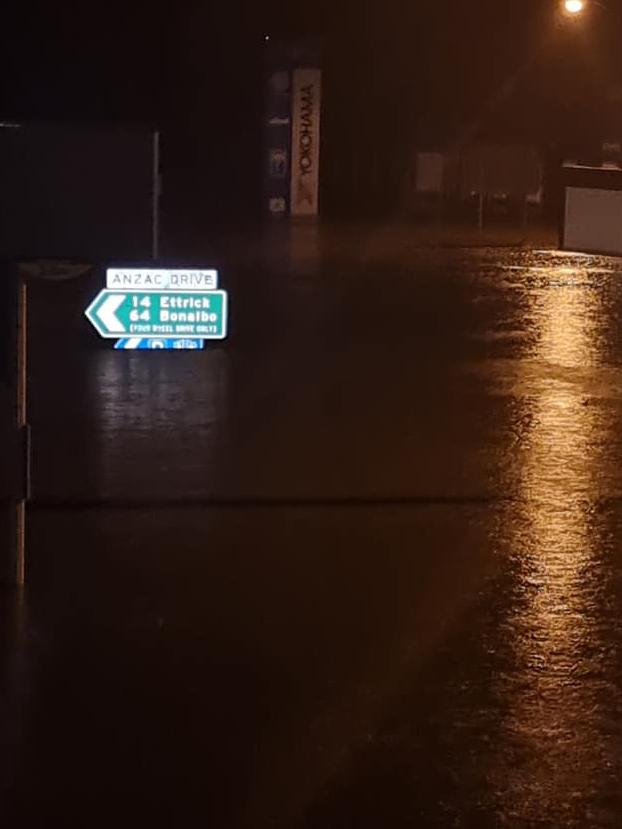 A road sign submerged in Kyogle.