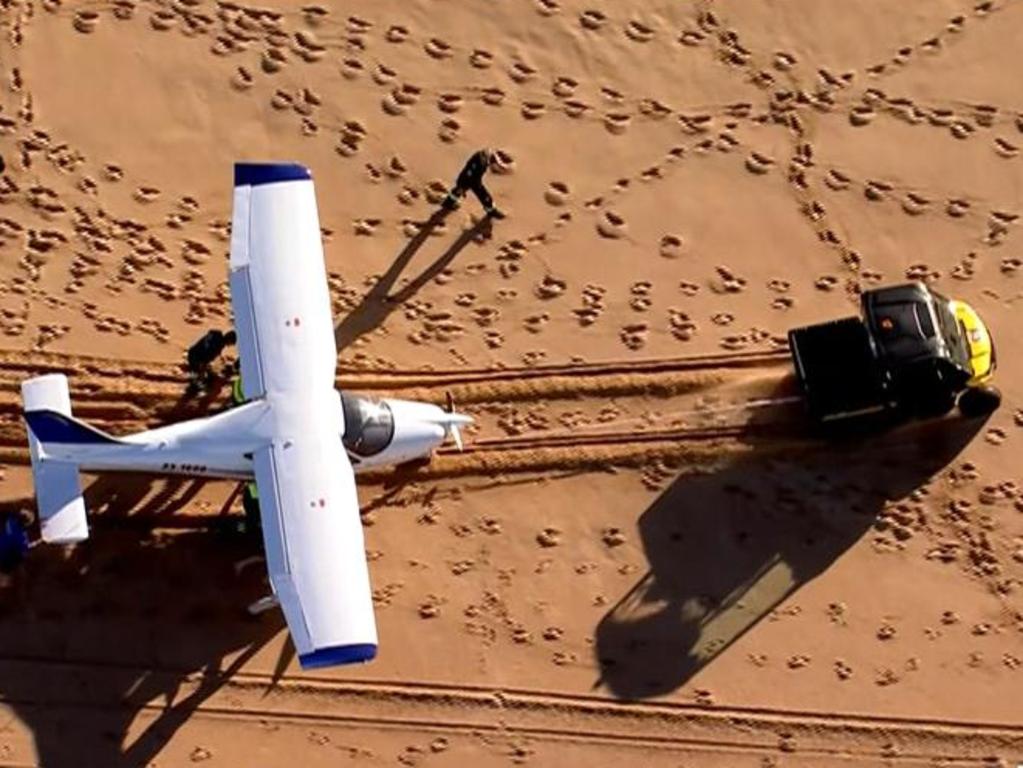 A vehicle tows the aircraft off Collaroy Beach. Picture: 7 News/Twitter