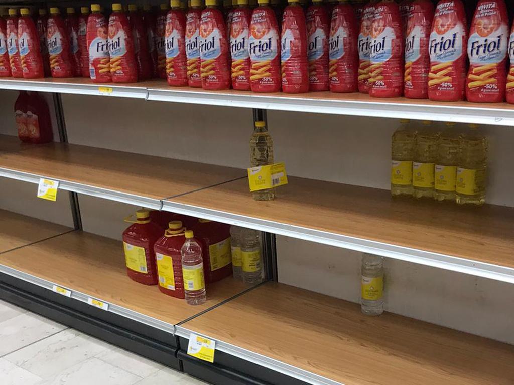 Empty shelves in a supermarket in Rozzano, near Milan where locals have been panic buying supplies. Picture: Antonio Calanni/AP