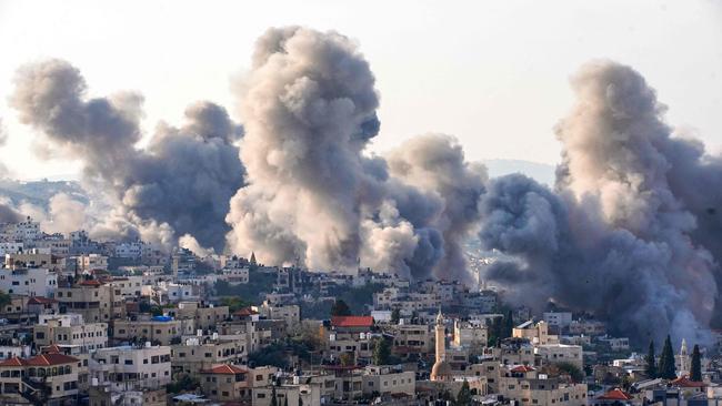 Smoke billows from the site of several explosions during an Israeli raid in the occupied West Bank city of Jenin. Picture: AFP.