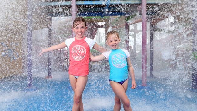 Sisters Simone Barry and Nicole Barry splash in the water park at Paradise Resort. Photo by Richard Gosling