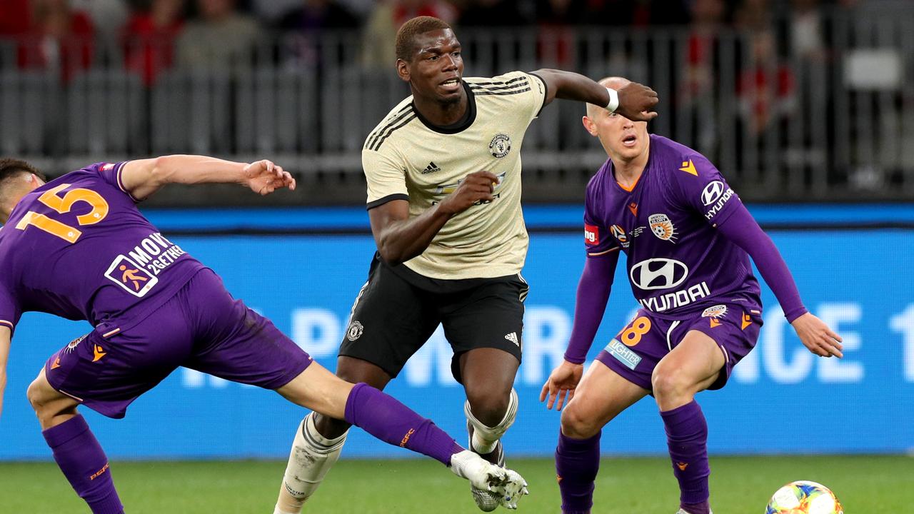 Paul Pogba (centre) of Manchester United in action during the Perth Glory and Manchester United football match at Optus Stadium in Perth, Saturday, July 13, 2019.  (AAP Image/Richard Wainwright) NO ARCHIVING, EDITORIAL USE ONLY