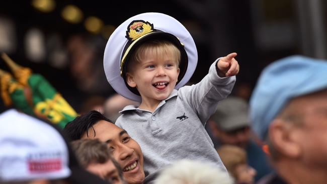 A young boy watches Melbourne’s Anzac Day parade. Picture: AFP