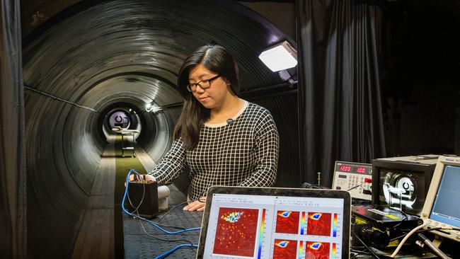 Researcher Joyce Mau sets up the new single photon avalanche diode camera for low light and 3-D imaging of remote and hostile areas in the DST testing tunnel.