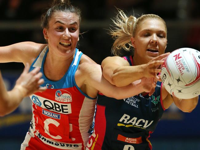 Swifts player Maddy Proud shoulder to shoulder with Vixens Kate Moloney.