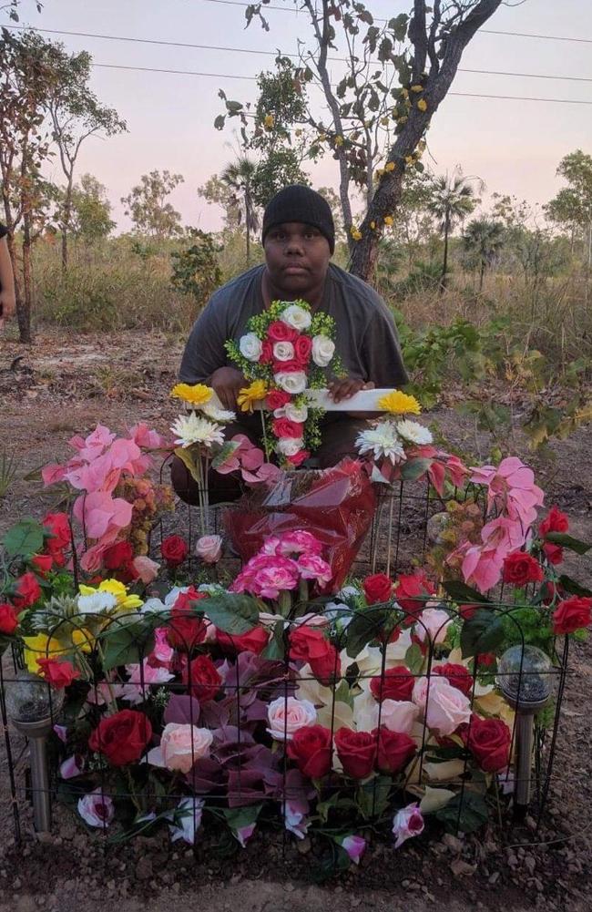 Janita Dixon, the daughter of alleged hit and run victim Kumanjayi Napurrurla Dixon, at her mother's roadside memorial.