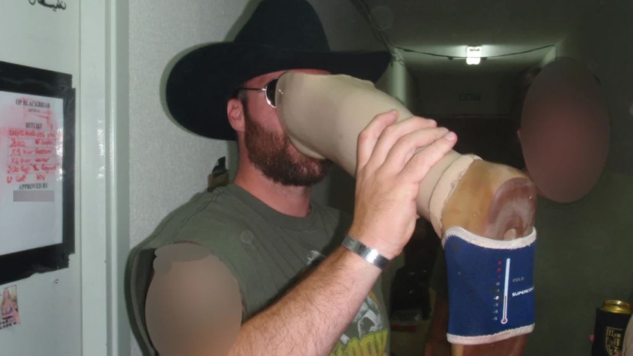 An unidentified soldier drinks from the leg at the ADF base. Picture: The Age