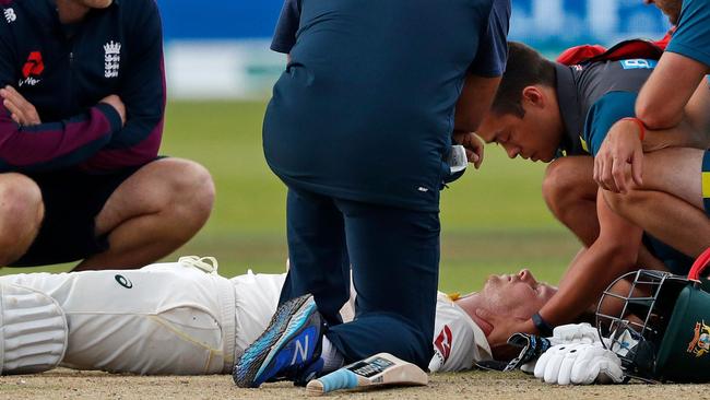 Steve Smith lies on the Lord’s pitch after being hit in the neck by a bouncer from England’s Jofra Archer. Picture: AFP