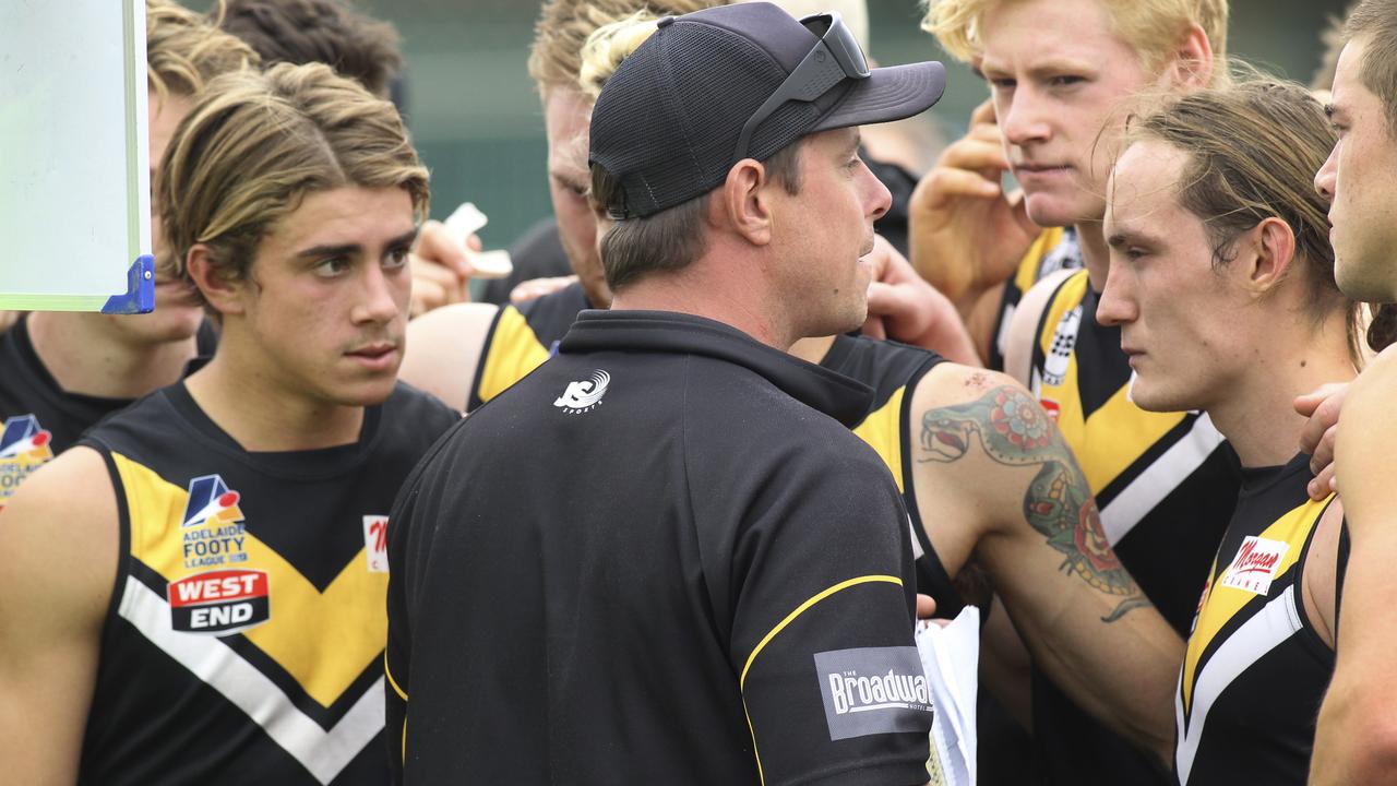 Amateur footy: Brighton v Adelaide University at Brighton Oval. Brighton Coach, Joel Tucker, addresses the players at three quarter time.13 April 2019. (AAP Image/Dean Martin)