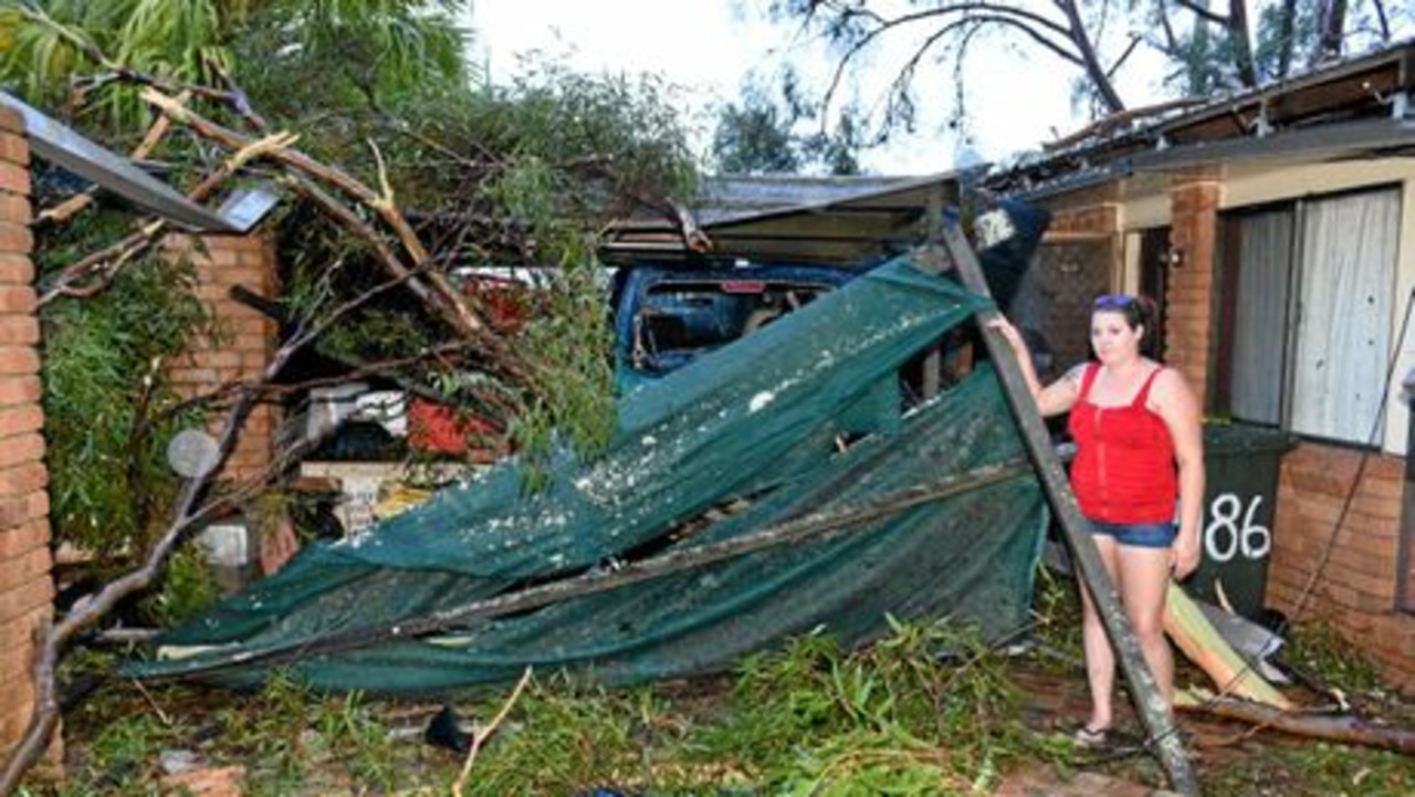 Shania Cameron at her grandparents' house, assessing the damage after a fallen tree crushed her grandparents' car. Picture: Alistair Brightman