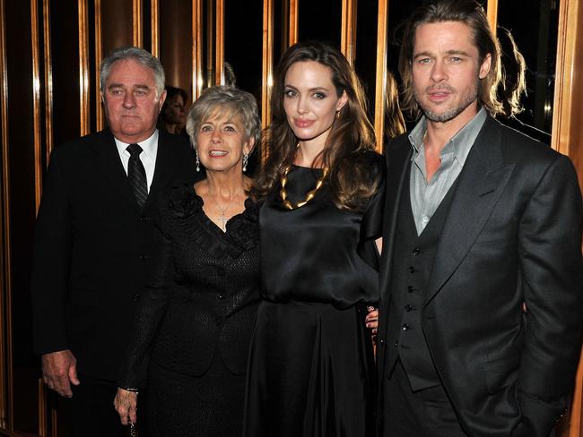 Angelina Jolie and Brad Pitt with Pitt’s parents in New York in December 2011. Picture: Stephen Lovekin/Getty Images