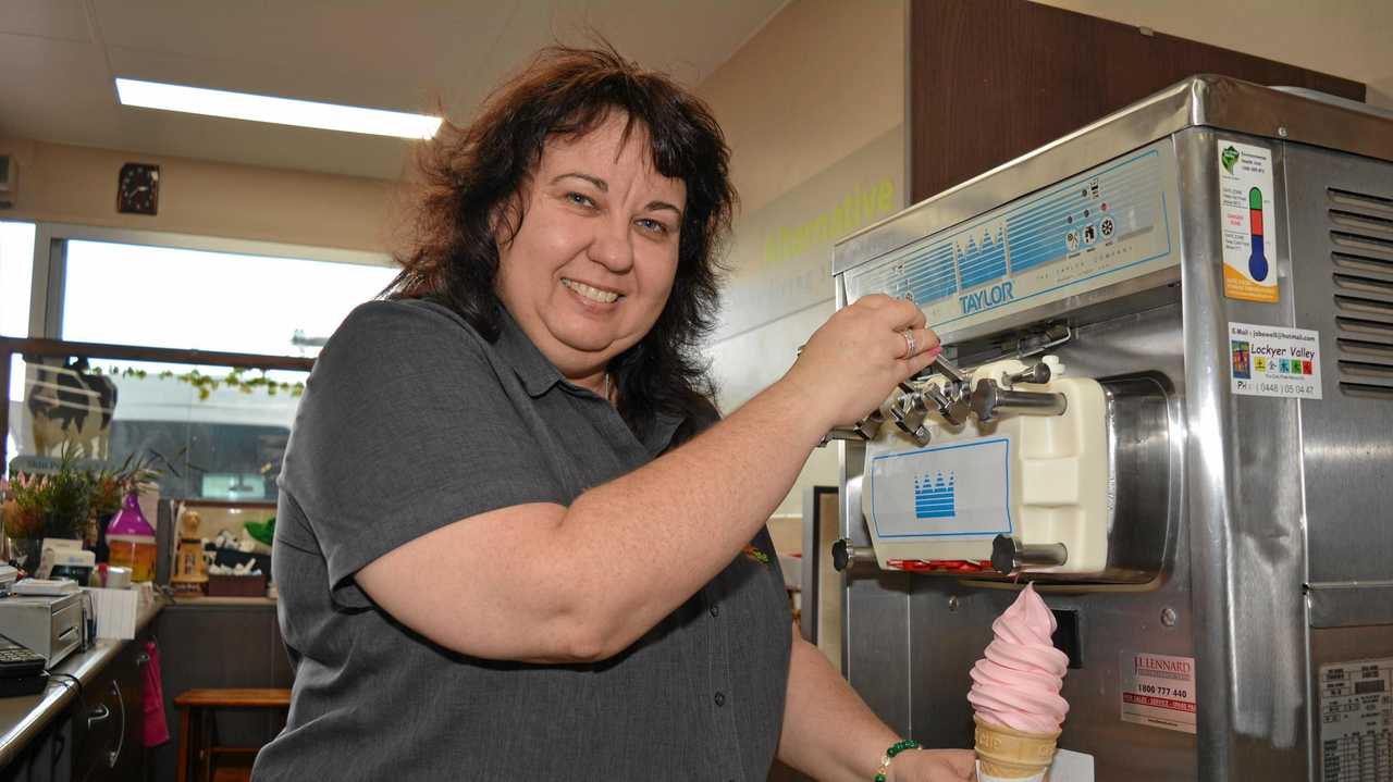 NICE TREAT: Anita Lyne pours one of the famous Gatton soft serve yoghurts. Picture: Meg Bolton