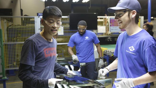 Wong He, left, Kenny Taylor and Jarred Gibson in Ohio. Picture: AP