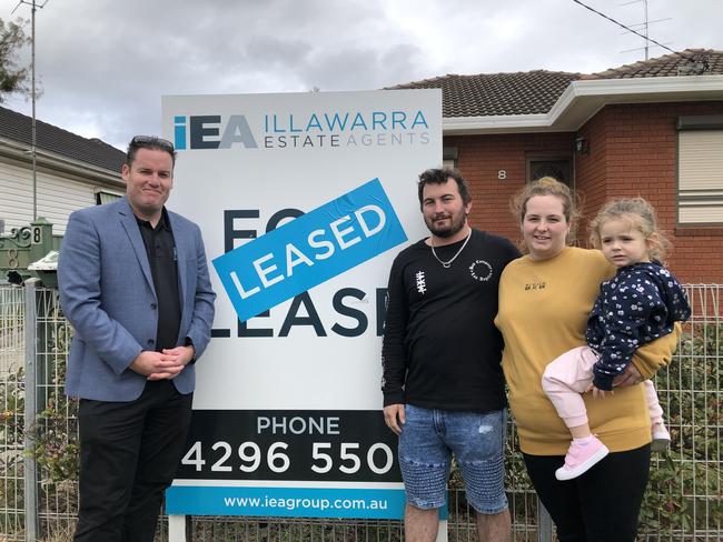 The Lennard family with Illawarra Estate Agents managing director Klayten Searl at the new rental on Friday.