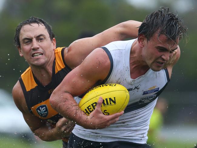 Jordan Keras (right) of Southport under pressure from Matthew Payne of Aspley during the NEAFL match played at the Fankhauser Reserve, Southport, Gold Coast. Photo: Regi Varghese