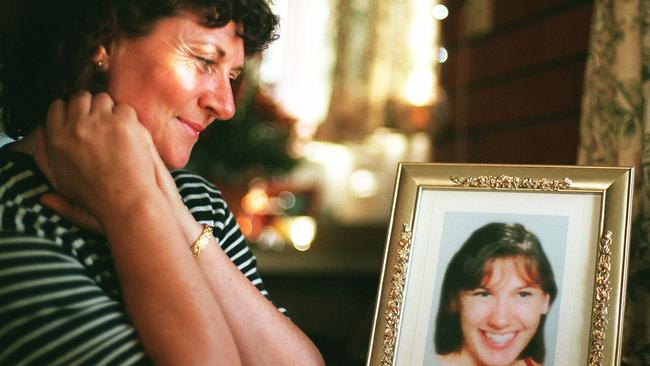 A file photograph of Marlene Bush with a portrait of her daughter Jacinta.