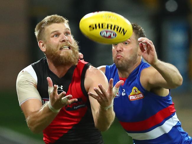 GOLD COAST, AUSTRALIA - JULY 17: Michael Hurley of the Bombers takes a mark during the round 7 AFL match between the Essendon Bombers and the Western Bulldogs at Metricon Stadium on July 17, 2020 in Gold Coast, Australia. (Photo by Chris Hyde/Getty Images)