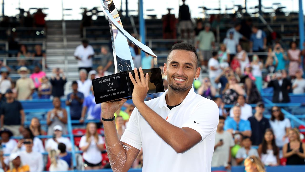 Nick Kyrgios of Australia holds up the trophy after defeating Daniil Medvedev of Russia.