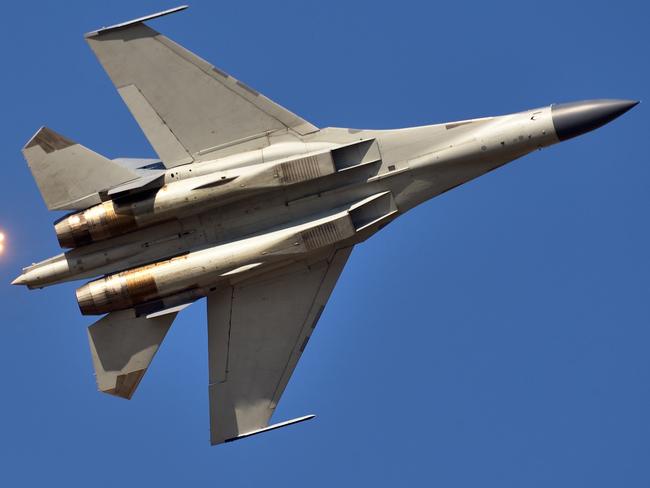 The moment of a Chinese Air Force fighter launching jamming bombs. Picture: Getty