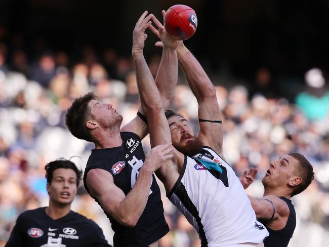 AFL Round 15. 30/06/2018.   Carlton v Port Adelaide at the MCG.  Carlton's Sam Rowe gets a fist in to spoil the mark of Port Adelaide's Charlie Dixon  . Pic: Michael Klein