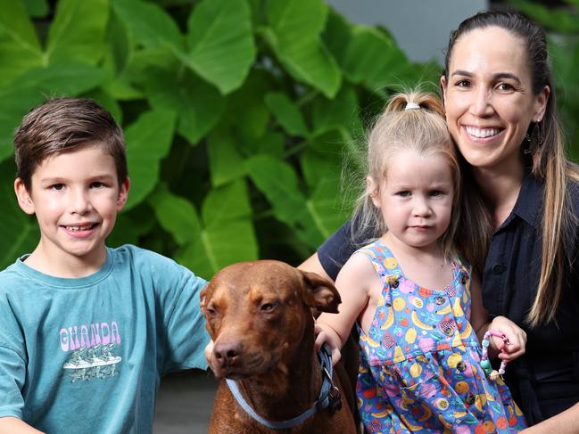 The Booth family was on a family holiday to Cape York three weeks ago when they found a camp dog dumped in bushland near Pajinka. The dog won the Booths over with his beautiful temperament, and the family bought him home to live with their other two camp dogs. Archie Booth, 6, Charlotte Booth, 3, and Pip Booth with their new dog Mango. Picture: Brendan Radke