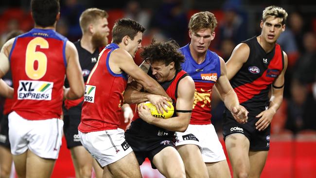 Essendon fans were fuming after a contentious holding the ball free kick was paid against Andrew McGrath. Picture: Getty Images