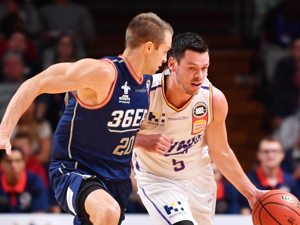 Nathan Sobey (left) takes on Jason Cadee during his time in Adelaide.