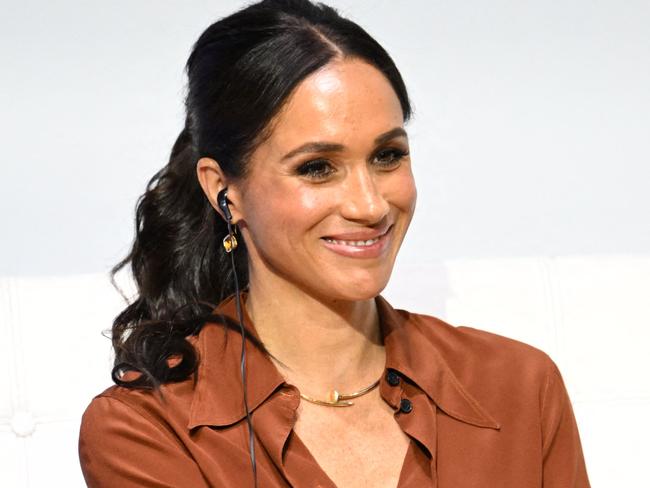 American actress Meghan Markle smiles during the 'Responsible Digital Future' forum in Bogota on August 15, 2024. Prince Harry and his wife, American actress Meghan Markle, arrived in Colombia at the invitation of Marquez, with whom they will attend various meetings with women and young people to reject discrimination and cyberbullying. (Photo by Raul ARBOLEDA / AFP)