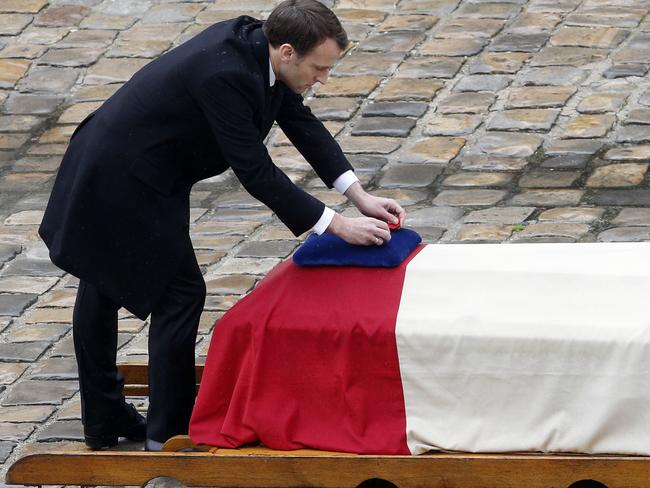 French President Emmanuel Macron posthumously awards the Legion of Honor to Lt- Col Arnaud Beltrame. Picture: AP