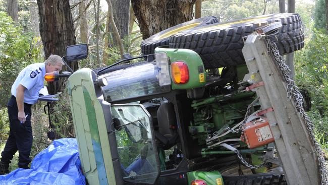 Police and Worksafe investigate the scene where a farmer was killed when the tractor he was driving rolled over.