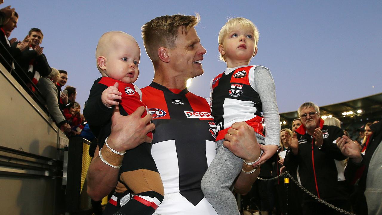 St Kilda's Nick Riewoldt walks down the race with sons James and William after playing his final AFL game. Picture: Michael Klein