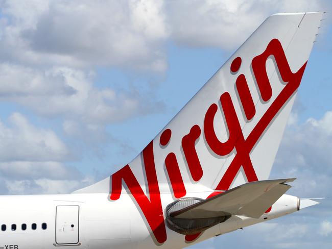 The new Virgin Australia logo on the tail of one of the Airbus A330 aircraft during announcement of rebranding from Virgin Blue at Sydney Airport in Sydney.
