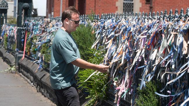 Locals place colourful ribbons on gates around St Patrick’s in Ballarat. Picture: Rob Leeson.