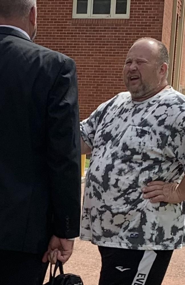 Jason Glen Smoothy speaking with his lawyer outside Taree courthouse on January 17, 2023.