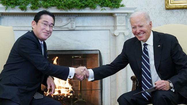 Joe Biden shakes hands with Japan's Prime Minister Fumio Kishida during a meeting in the Oval Office in January. Picture: AFP.