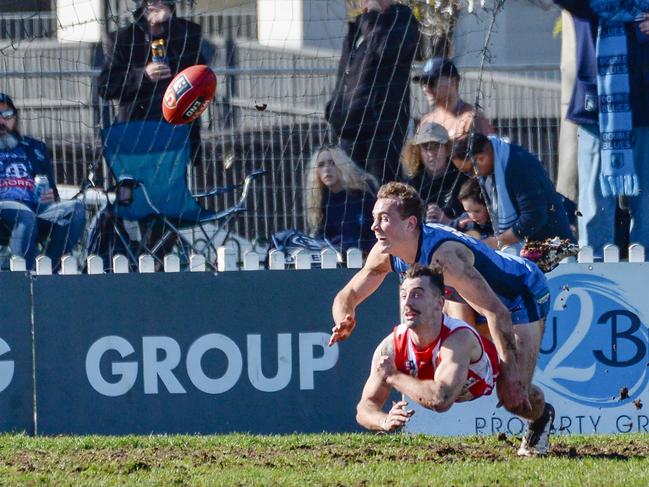 North’s Alex Spina gets the ball away from Tom Emmett during a 2020 SANFL game between Sturt and North Adelaide at Unley Oval. Picture: Brenton Edwards