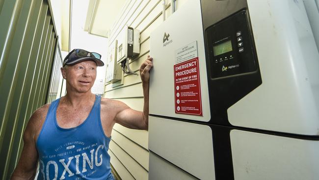 Peter Dunn signed up for a virtual power plant where he will earn money from selling power from his home battery into the grid. Picture: AAP / Roy Vandervegt