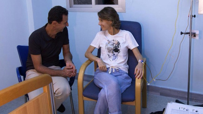 Assad sitting next to Asma as she begins treatment for early-stage breast cancer at a hospital in Damascus in 2018. Picture: Handout/AFP