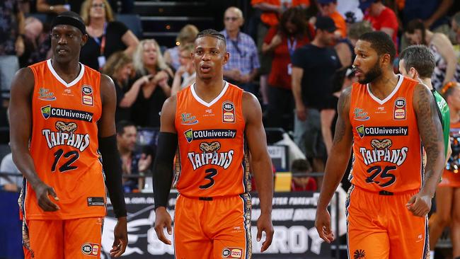 A dejected Kouat Noi, Scott Machado and DJ Newbill at full time in the National Basketball League (NBL) match between the Cairns Taipans and the Perth Wildcats, held at the Cairns Convention Centre. PICTURE: BRENDAN RADKE.