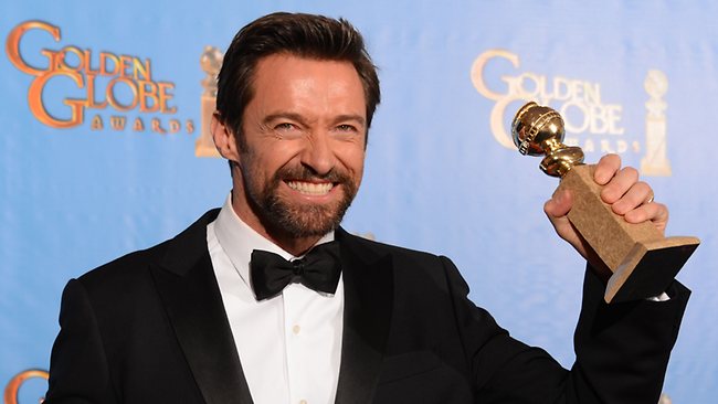 Hugh Jackman celebrates in the press room after winning the Golden Globe for best actor in a motion picture comedy or musical for Les Miserables.