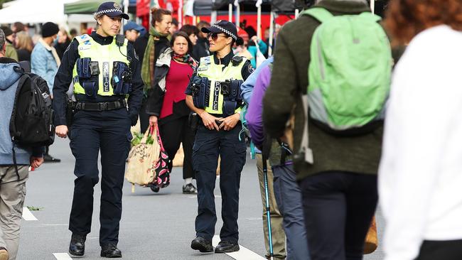 Police officers conduct compliance checks at the Farmgate Market. Picture: Zak Simmonds